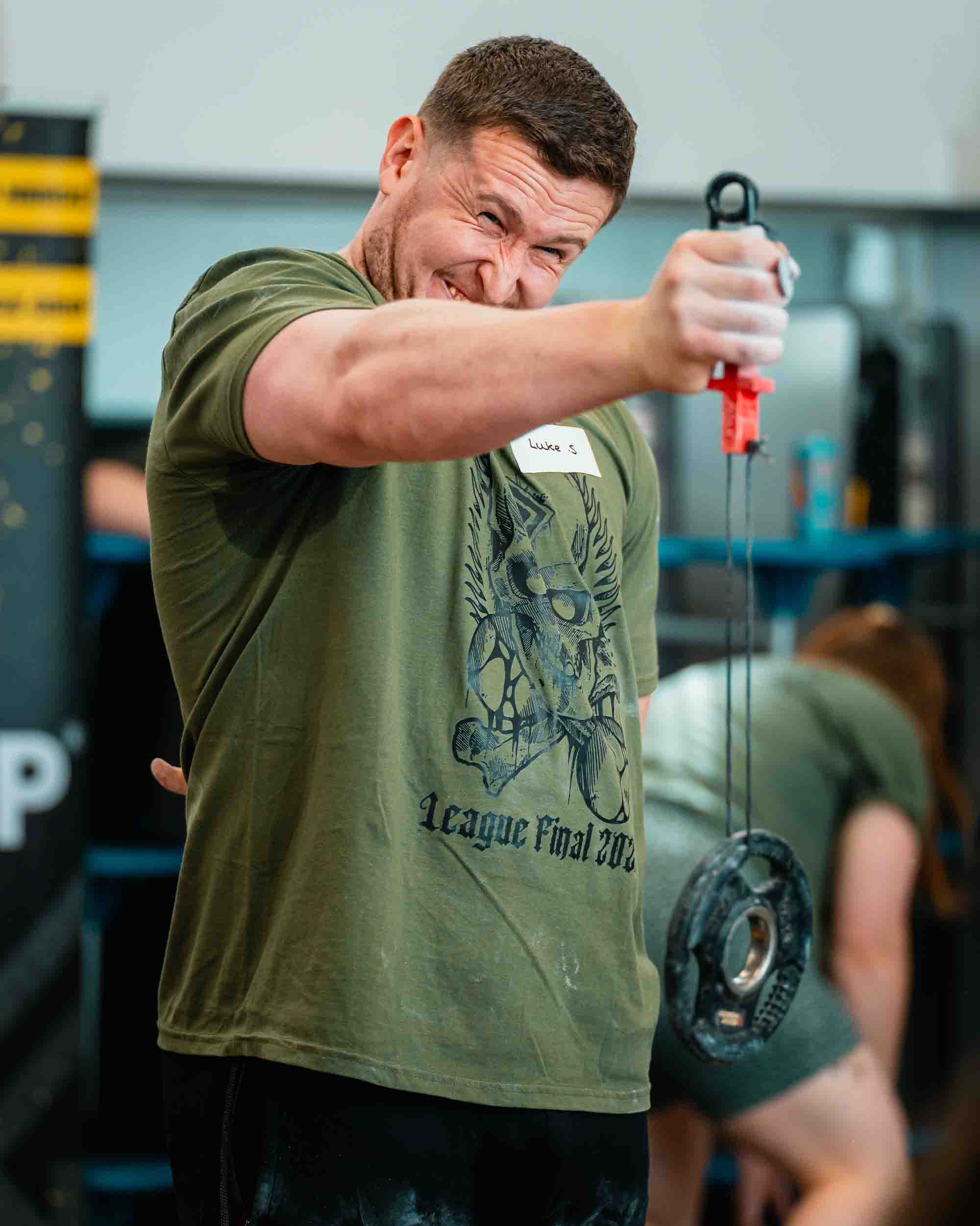 Man lifting weights in a gym setting