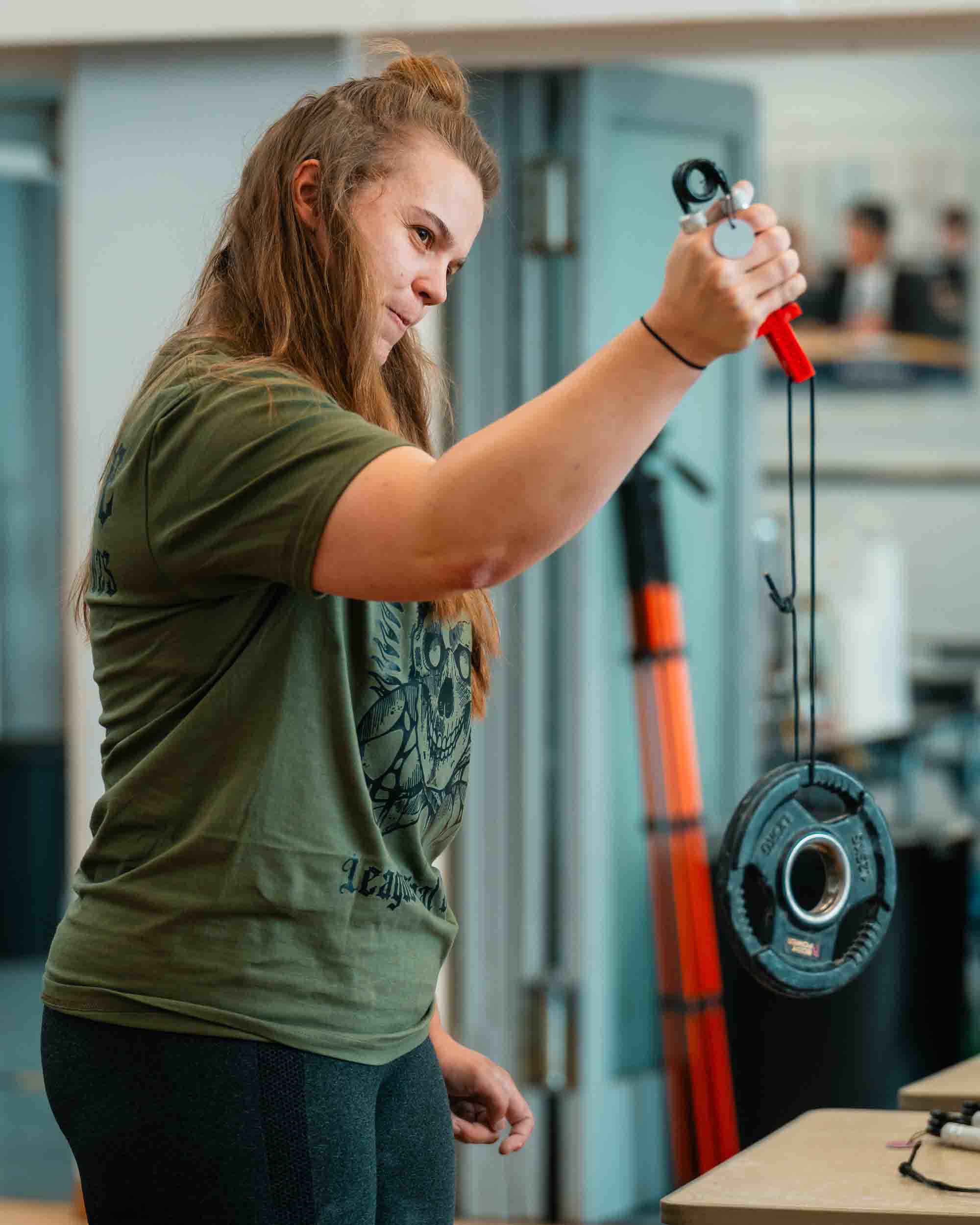Person using a fishing reel in an indoor setting